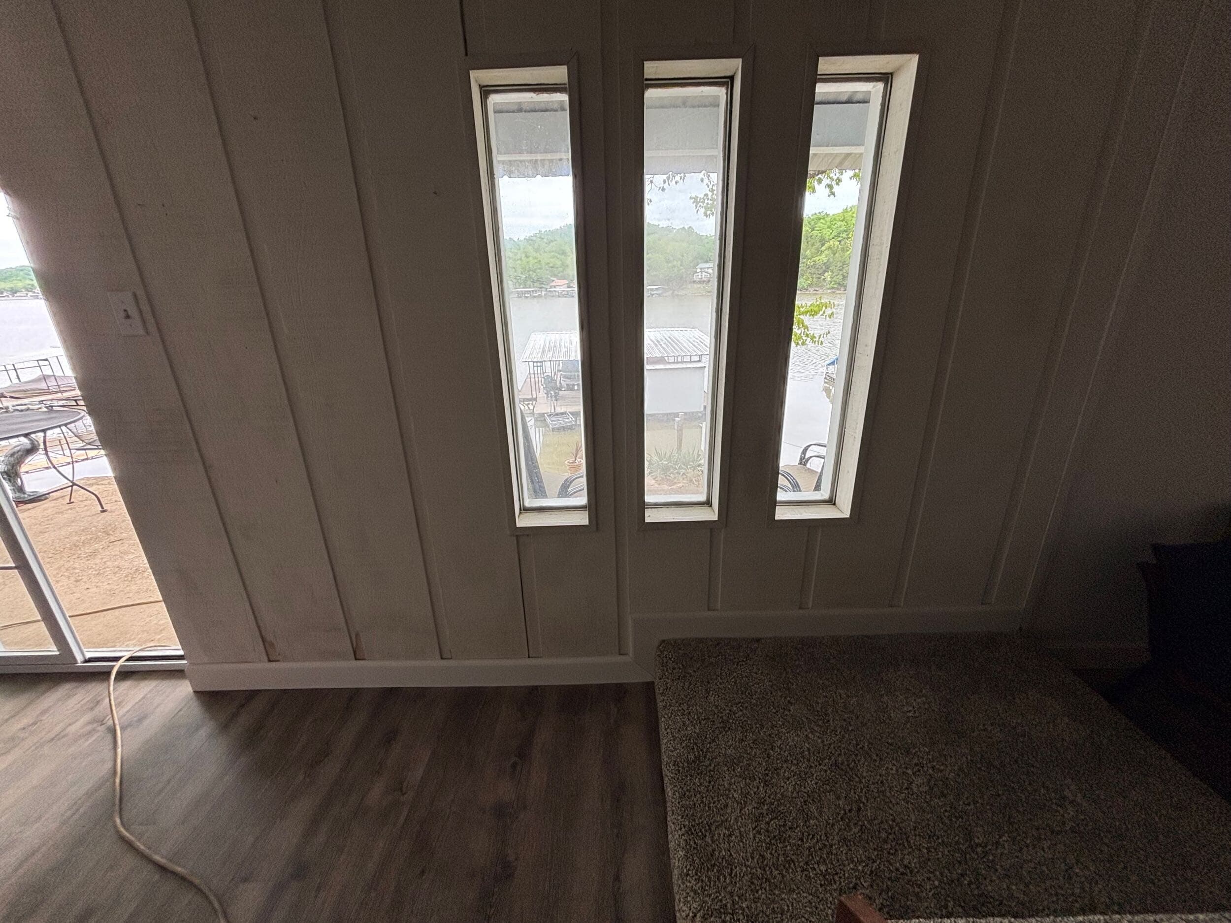 precise flooring installation near stairs and carpet at Lake of the Ozarks