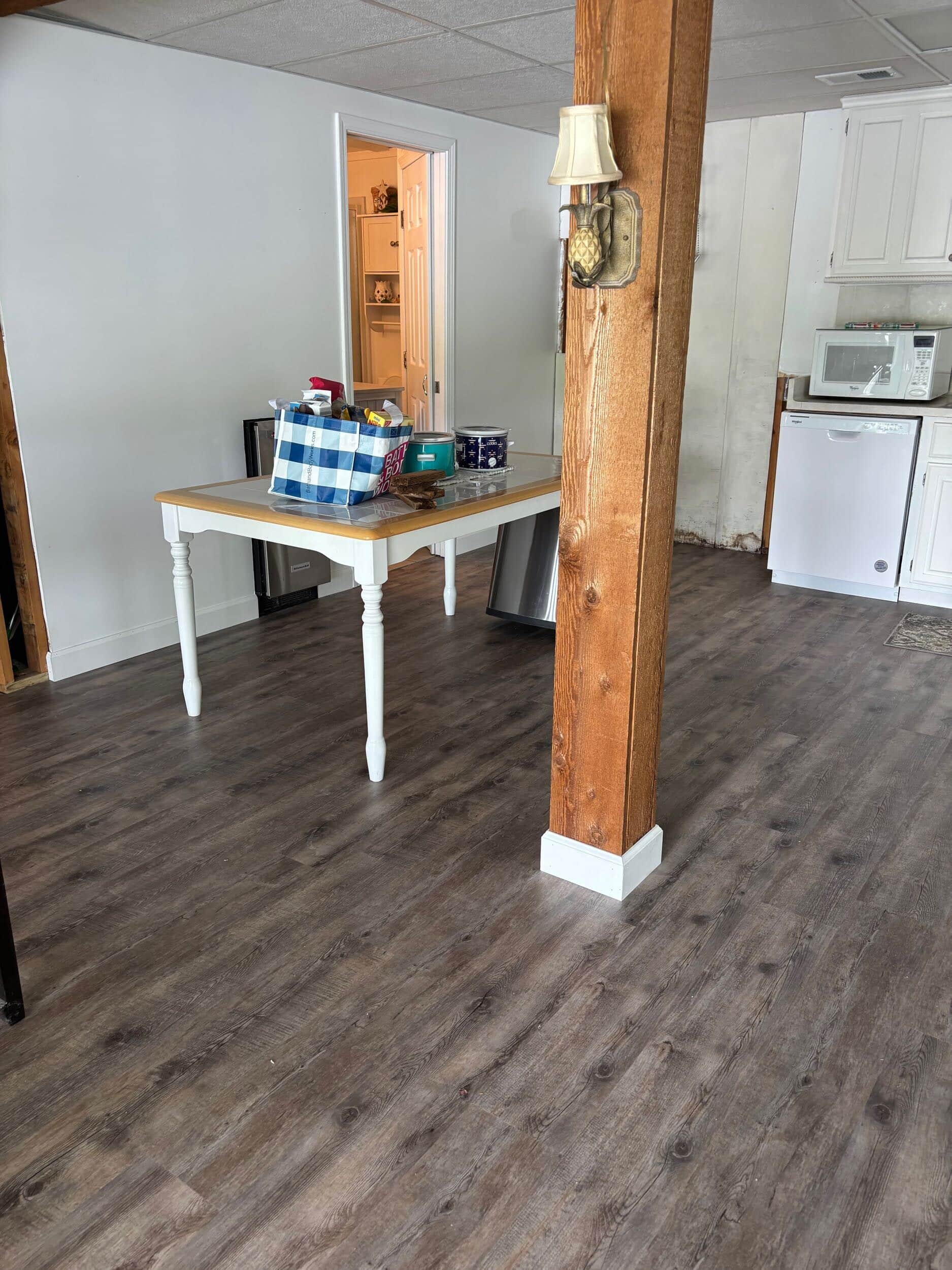 new trim and baseboards after installing LVT in lake of the ozarks handyman services home remodeling project