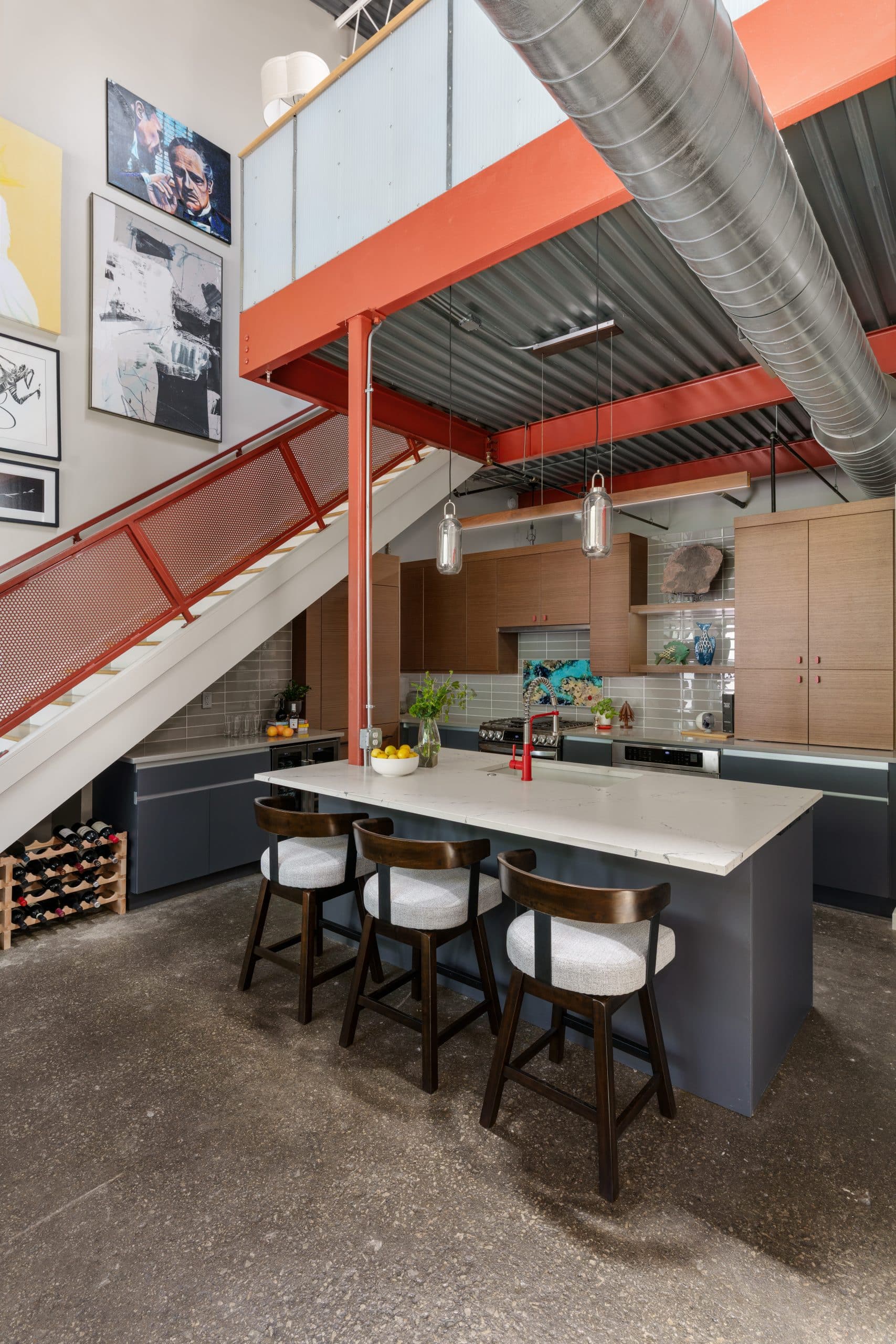 Urban contemporary kitchen remodel in a Kansas City River Market condo with warm wood cabinetry, dark cabinets and bold red accents Urban contemporary kitchen remodel in a Kansas City River Market condo with warm wood cabinetry, dark cabinets and bold red accents
