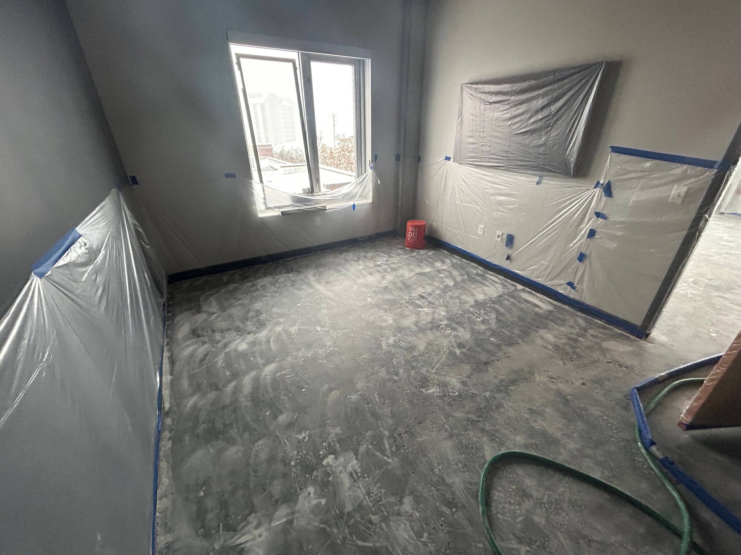 concrete floor urban look in KC condo remodel
