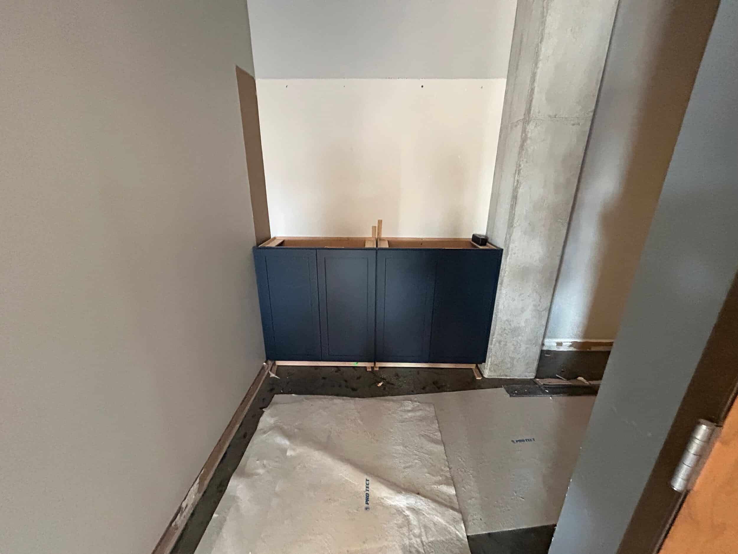 KC condo remodel construction phase with entryway custom cabinetry installed