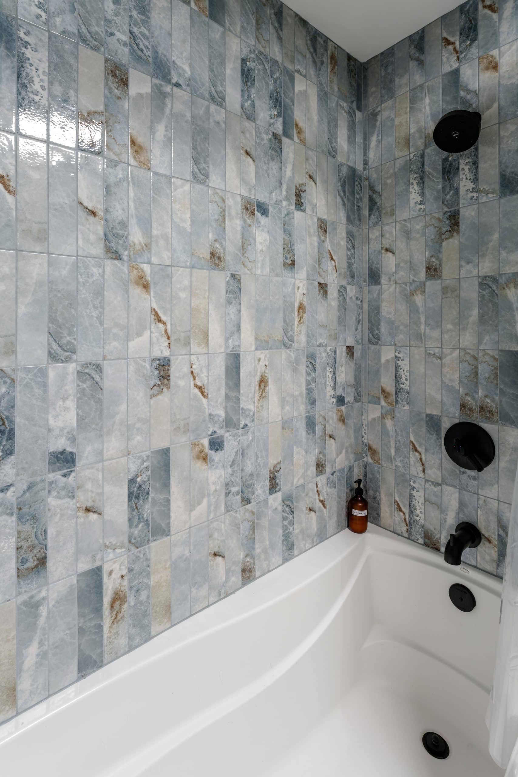 condo bathroom remodel with blue and grey tile