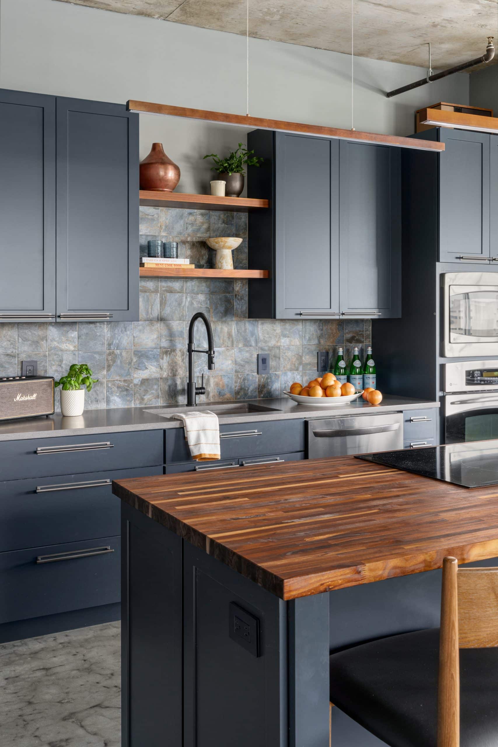 industrial moody but warm contemporary westport KCMO condo remodel by Schloegel handyman team