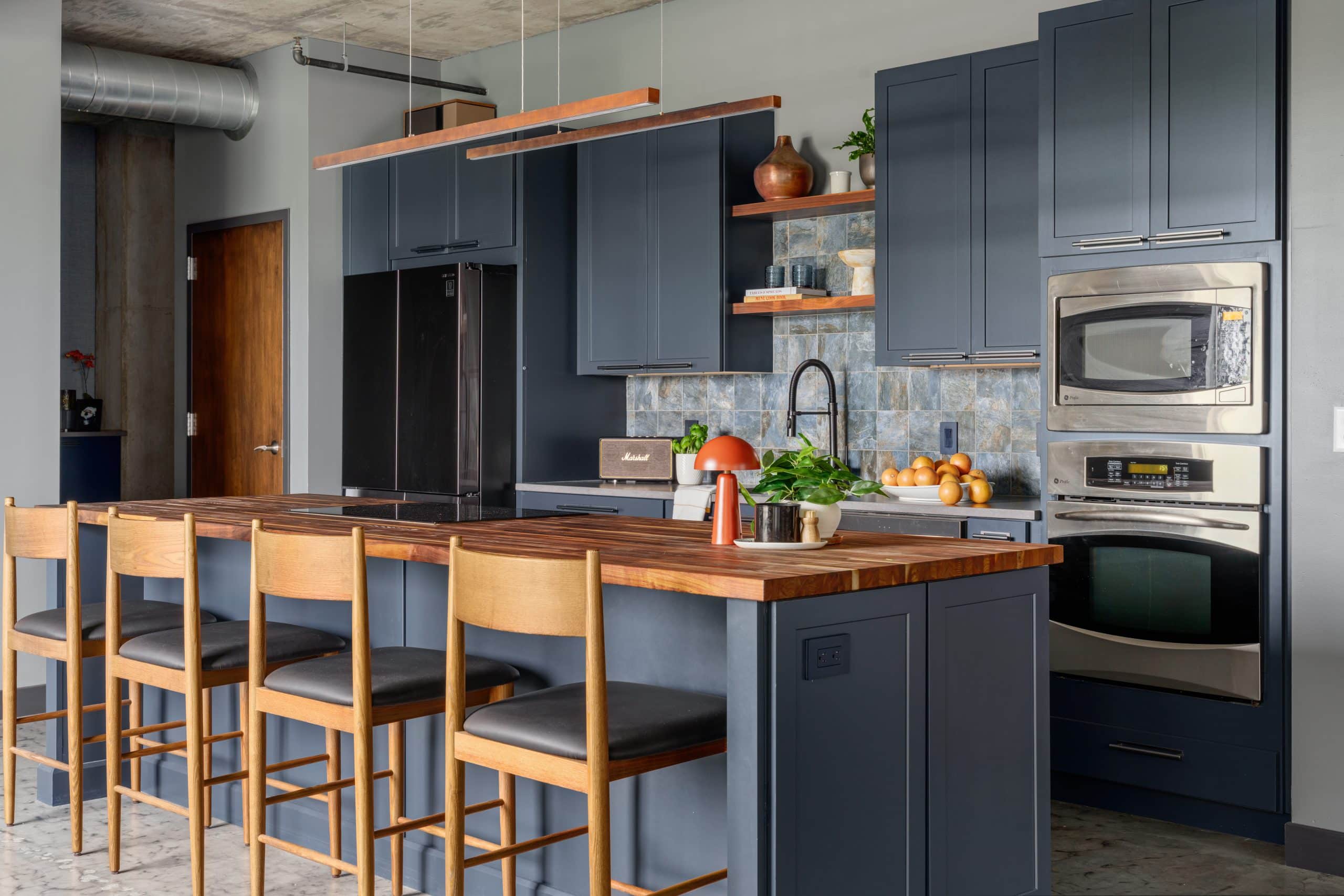 industrial moody but warm contemporary westport KCMO condo remodel by Schloegel handyman team